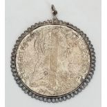 A Mother Theresa Silver Coin Pendant. Total Weight 34.82g. 4.5cm in diameter.