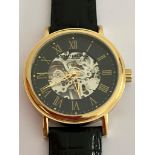 Gentlemans STUHRLING SKELETON WRISTWATCH from MAX STUHRLING of NEW YORK, Finished in gold tone