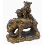 An Antique Excellent Quality Chinese Bronze of a Young Child on an Elephant. 8cm x 7cm. 436g