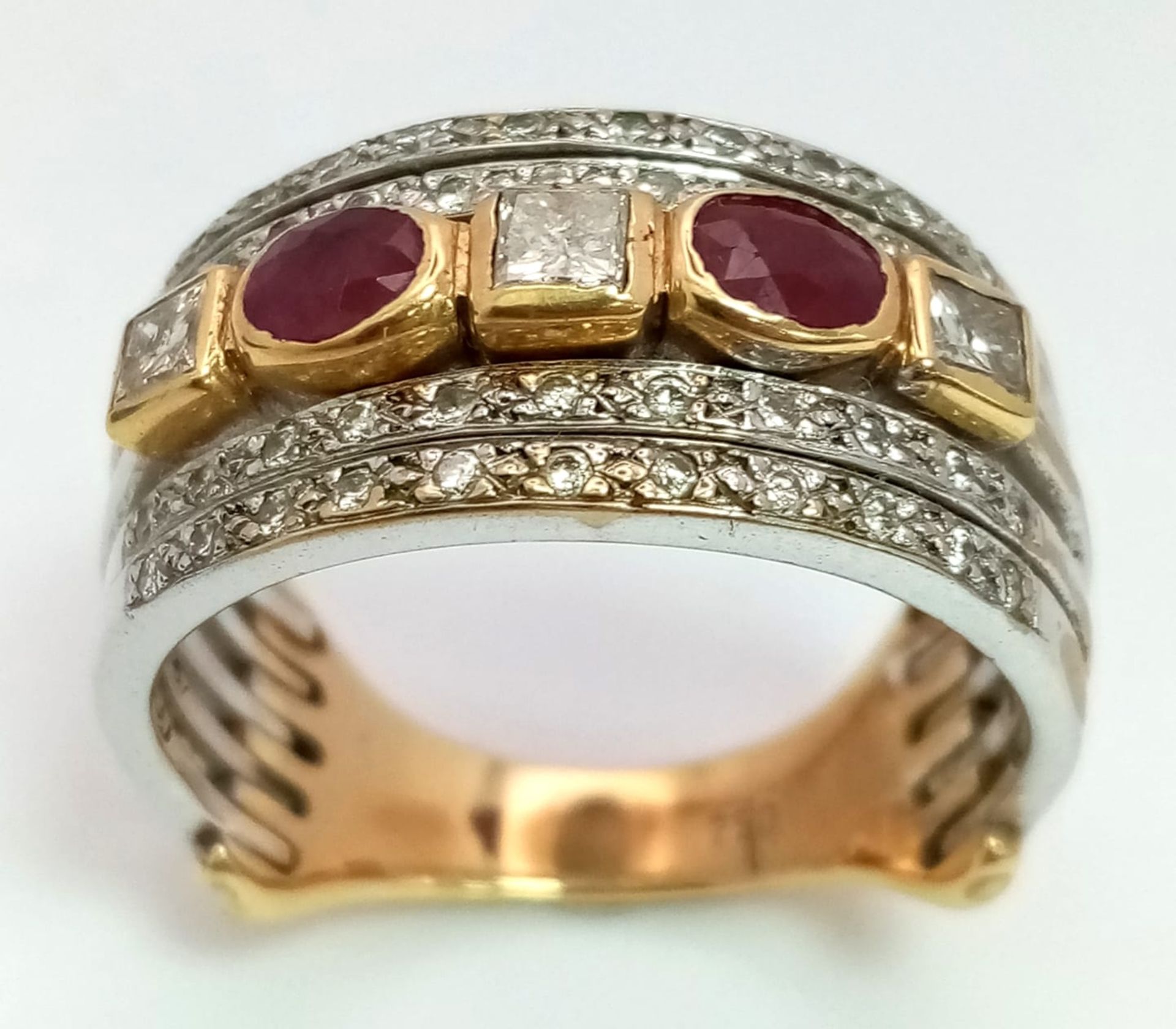 A Statement 18k Yellow, White Gold and Gemstone Band Ring. A Central reservation of oval rubies - Image 5 of 8