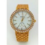 A Delaneau 18k Yellow Gold and Diamond-Set Ladies Watch. 18k gold bracelet and case - 34mm. White