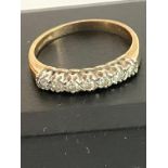 9 carat GOLD and DIAMOND RING Having seven clear white sparkling DIAMONDS set to top in line