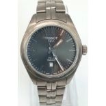 A Tissot Titanium PR10 Ladies Watch. Titanium strap and case - 33mm. Grey dial with date window.
