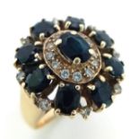 A 9K YELLOW GOLD DIAMOND & SAPPHIRE CLUSTER RING,. TOTAL WEIGHT 6.4G. SIZE L