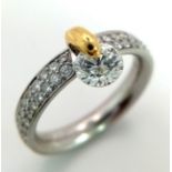 A Gorgeous 950 Platinum and 18K Gold and Diamond Ring with Diamond Shoulders. 0.76ct brilliant