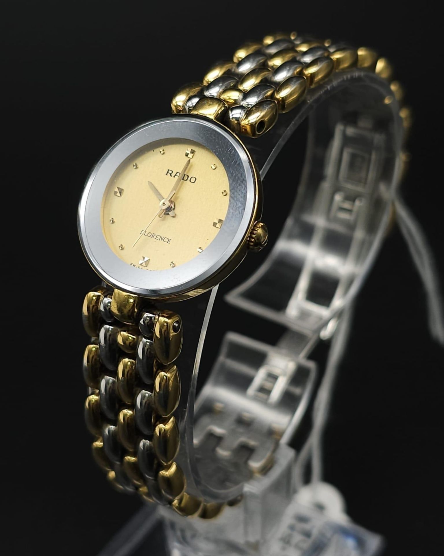 A Rado 'Florence' Quartz Ladies Watch. Two tone bracelet and case - 23mm. Gold tone dial. Comes with