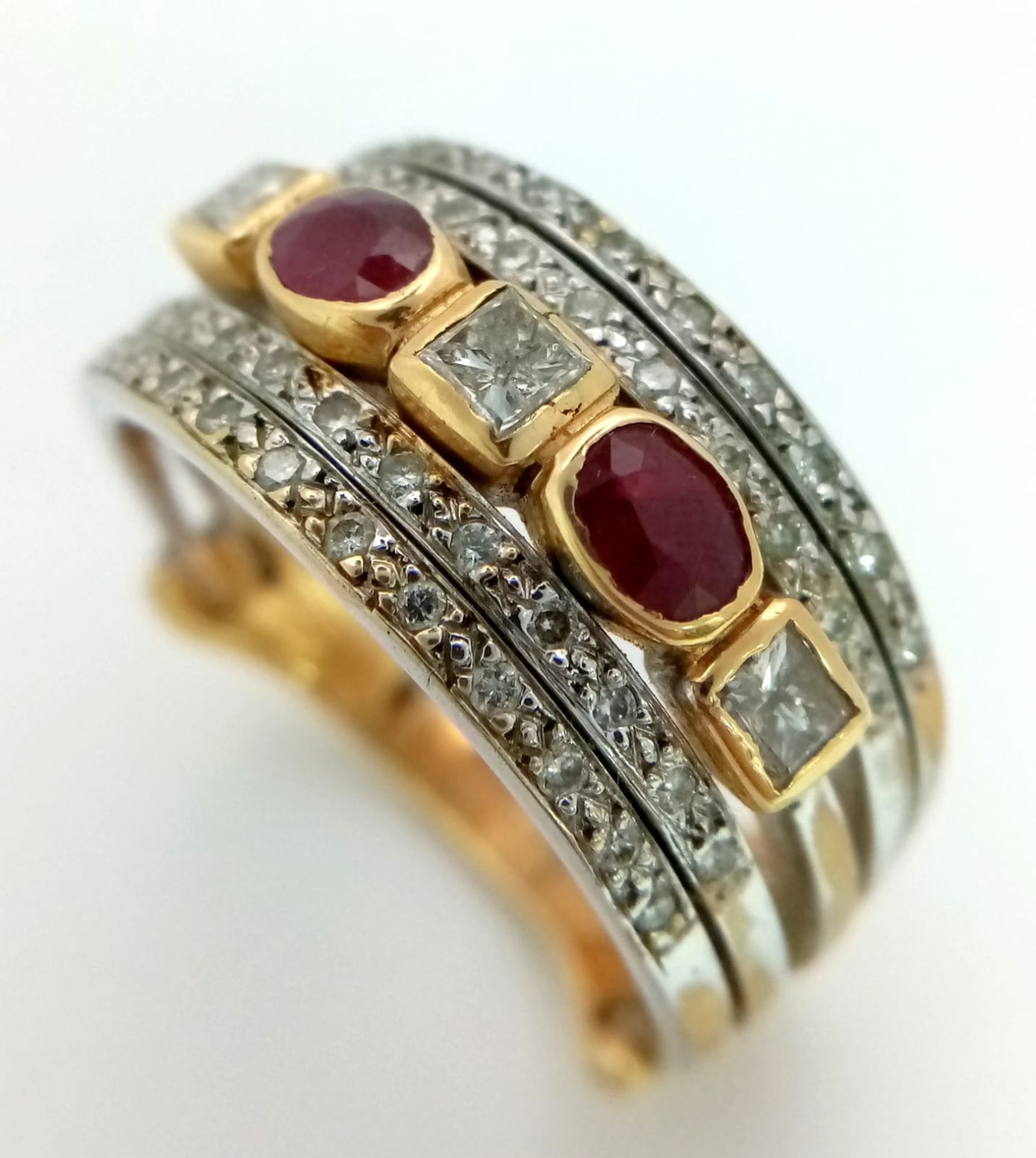 A Statement 18k Yellow, White Gold and Gemstone Band Ring. A Central reservation of oval rubies - Image 3 of 8