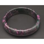 A Chinese Black and Purple Jade Bangle. 6cm inner diameter. 16mm width.