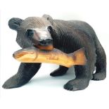 A Wooden Grizzly Bear and Unlucky Salmon Sculpture. 40cm x 25cm.