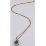 A Sapphire and Diamond Pendant set in 9K Gold on a 9K Yellow Gold Disappearing Necklace. 15mm and