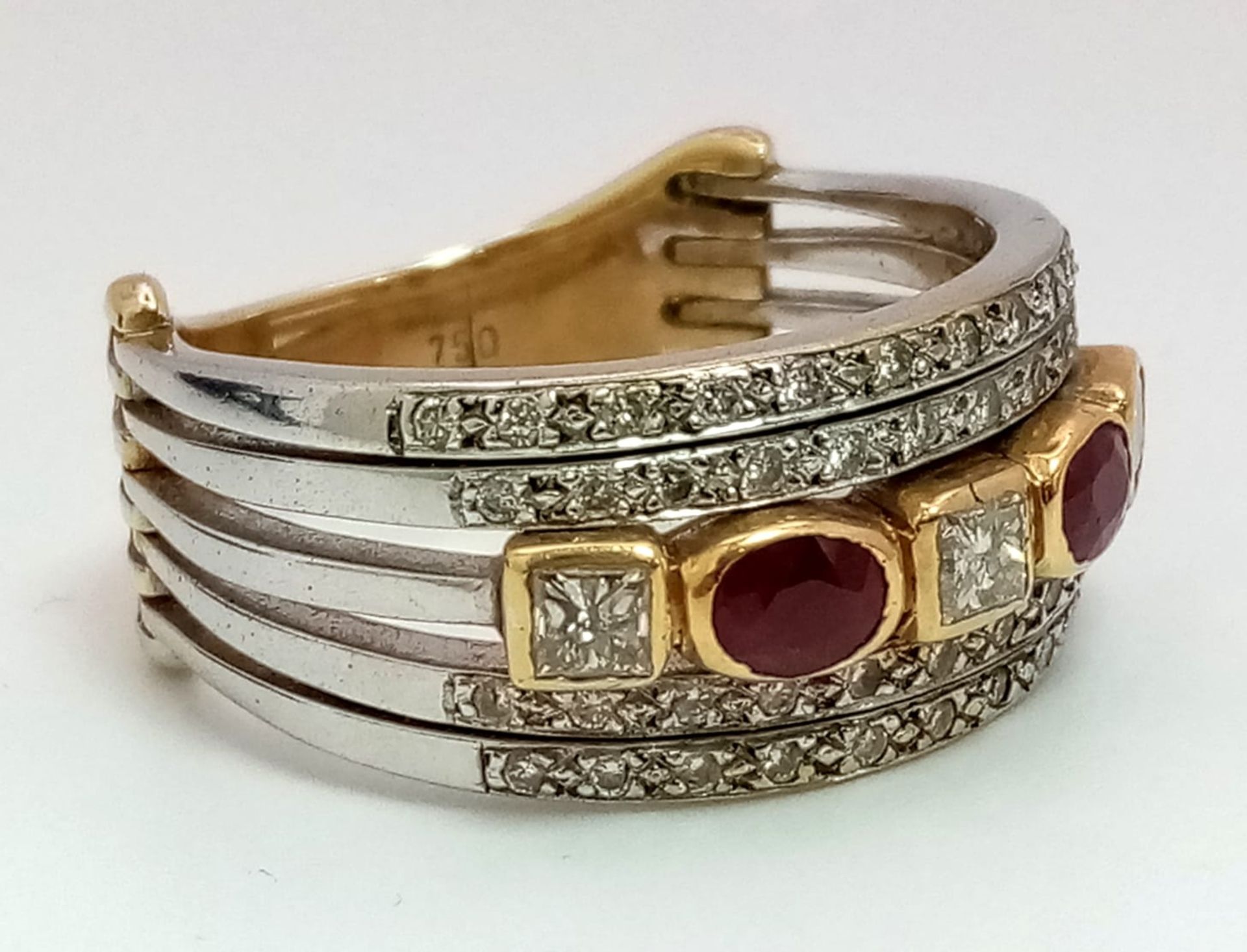 A Statement 18k Yellow, White Gold and Gemstone Band Ring. A Central reservation of oval rubies - Image 4 of 8