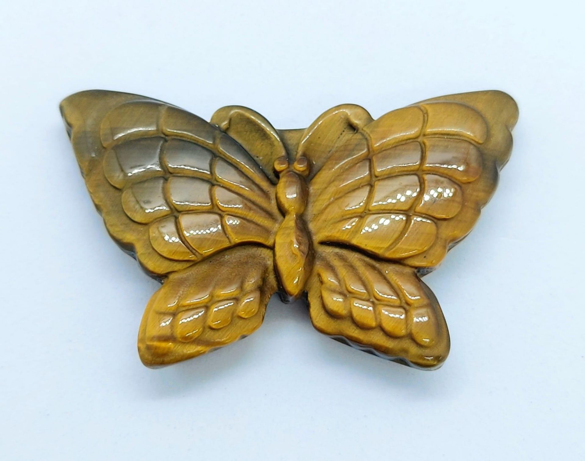 A Tigers Eye Hand Carved Butterfly Figurine. 5cm wingspan.