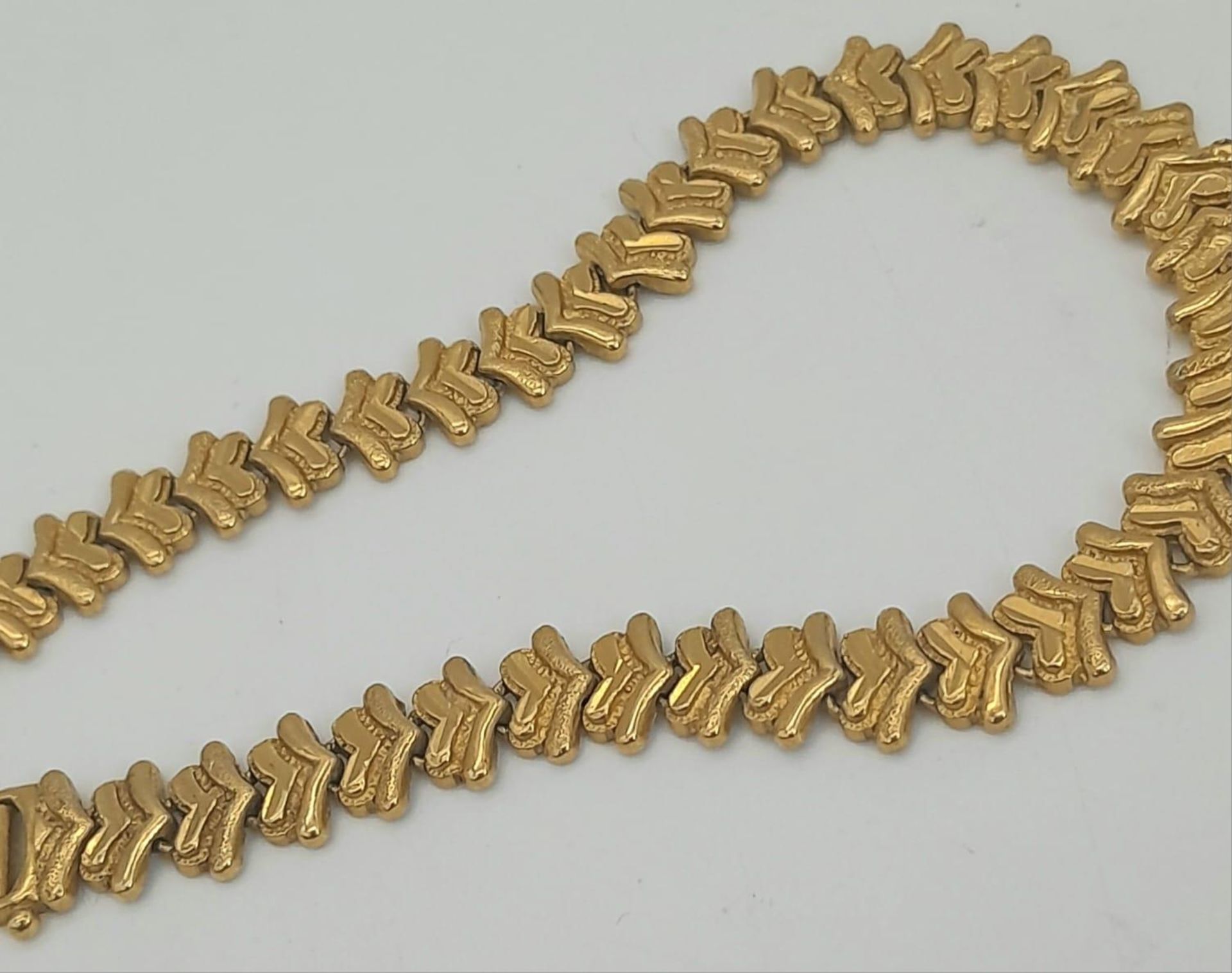 A 22k Yellow Gold Asian Inspired Chevron Bracelet. 18cm. 16.8g weight. 916 hallmark. - Image 3 of 5