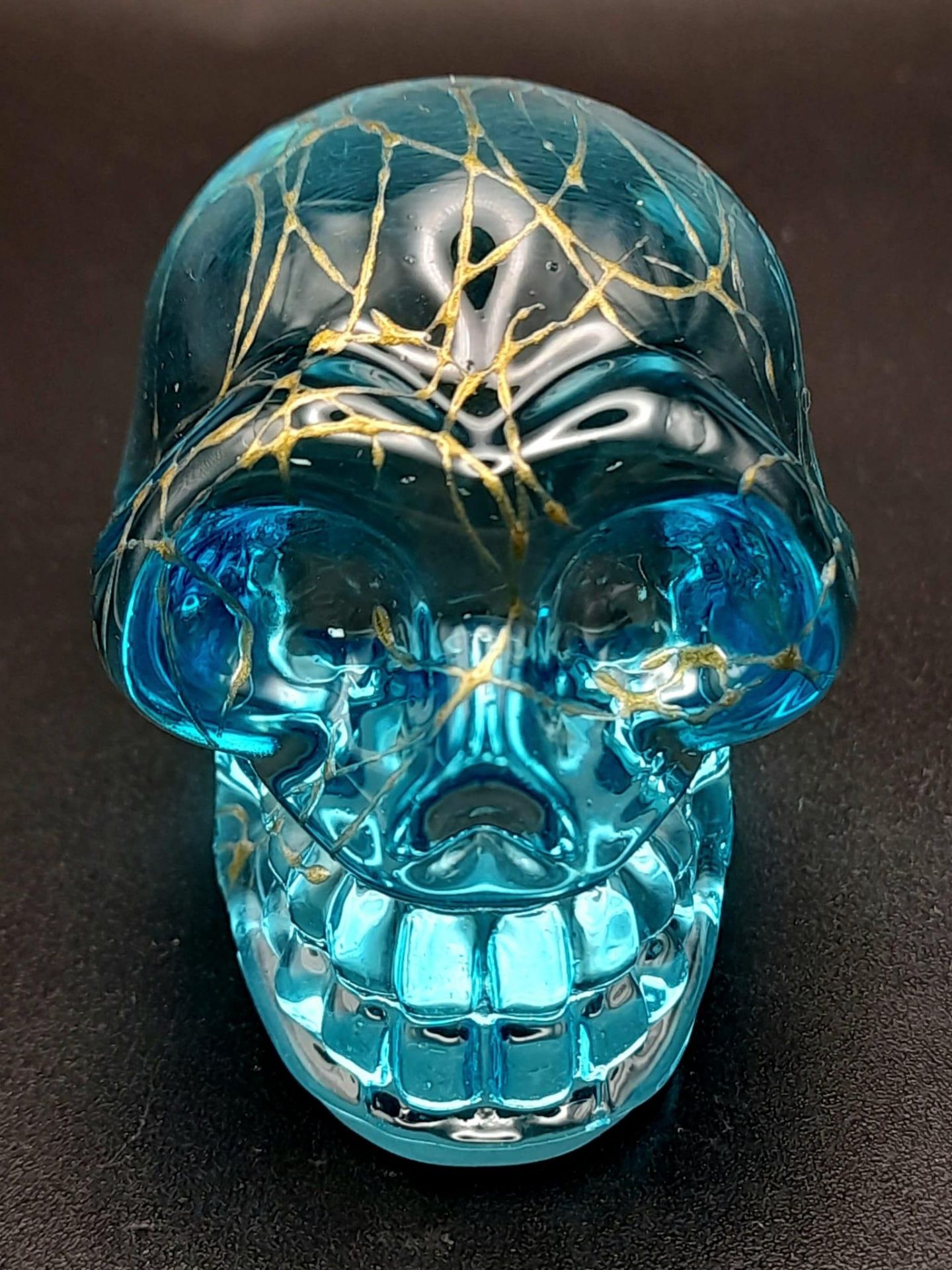 A Hand-Carved Blue Crystal Quartz Skull Figure. Paperweight or curiosity. %cm x 4cm