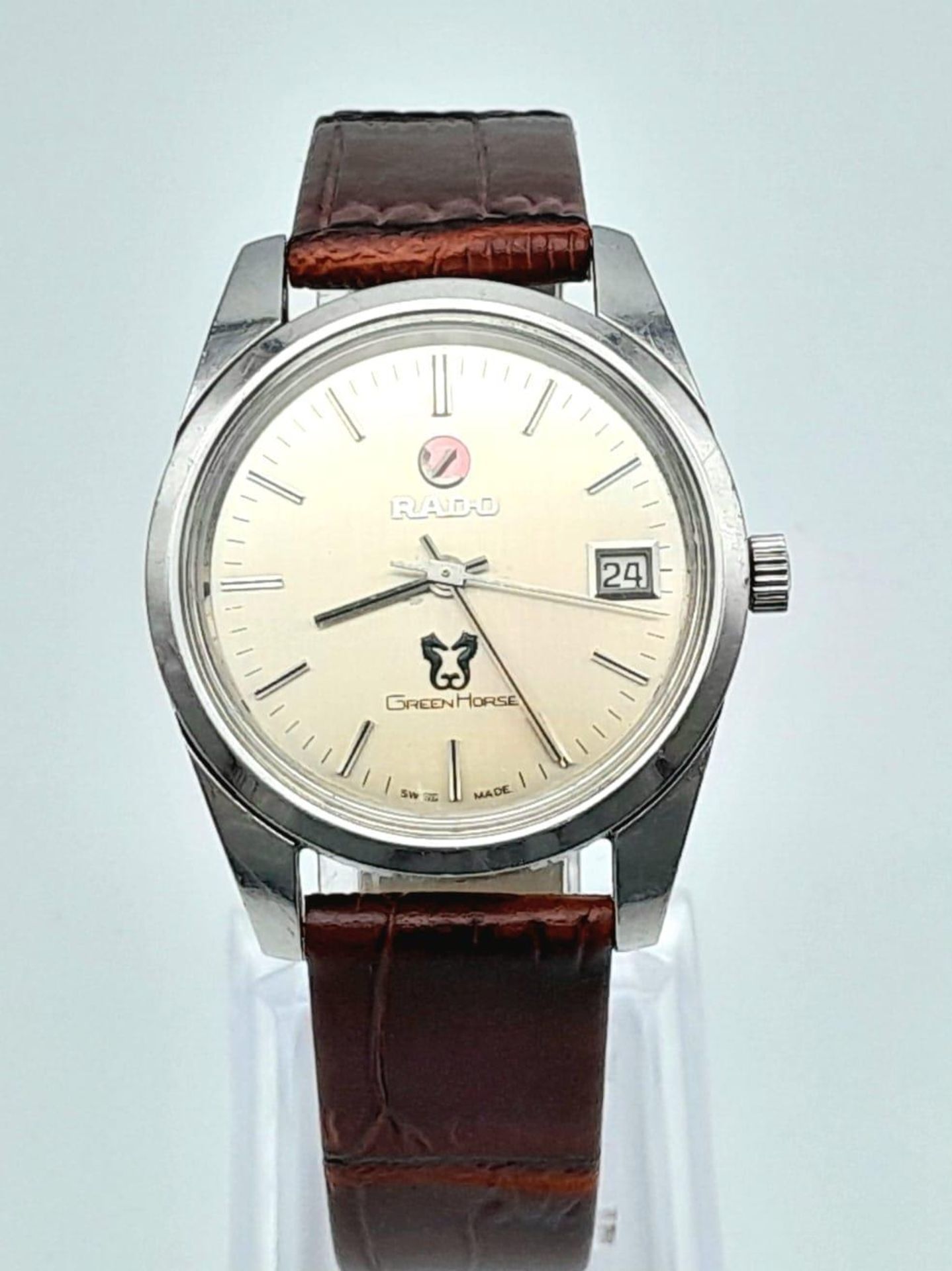 A Vintage Rado Green Horse Gents Watch. Brown leather strap. Silver tone dial with date window.