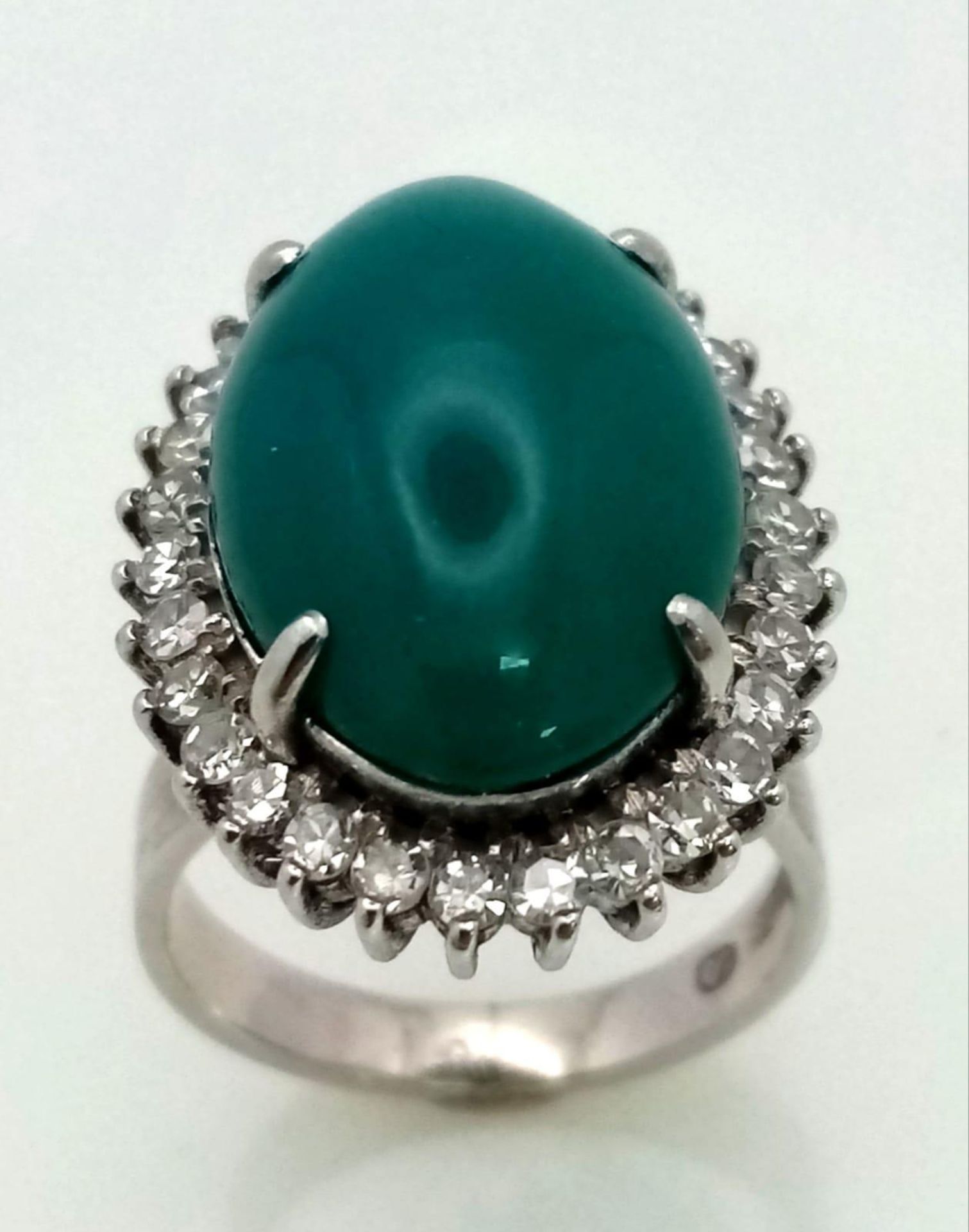 A 18K WHITE GOLD GREEN JADE CENTRE STONE SURROUNDED BY DIAMONDS RING . 0.66CT CABOCHON DIAMOND TOTAL - Image 2 of 9