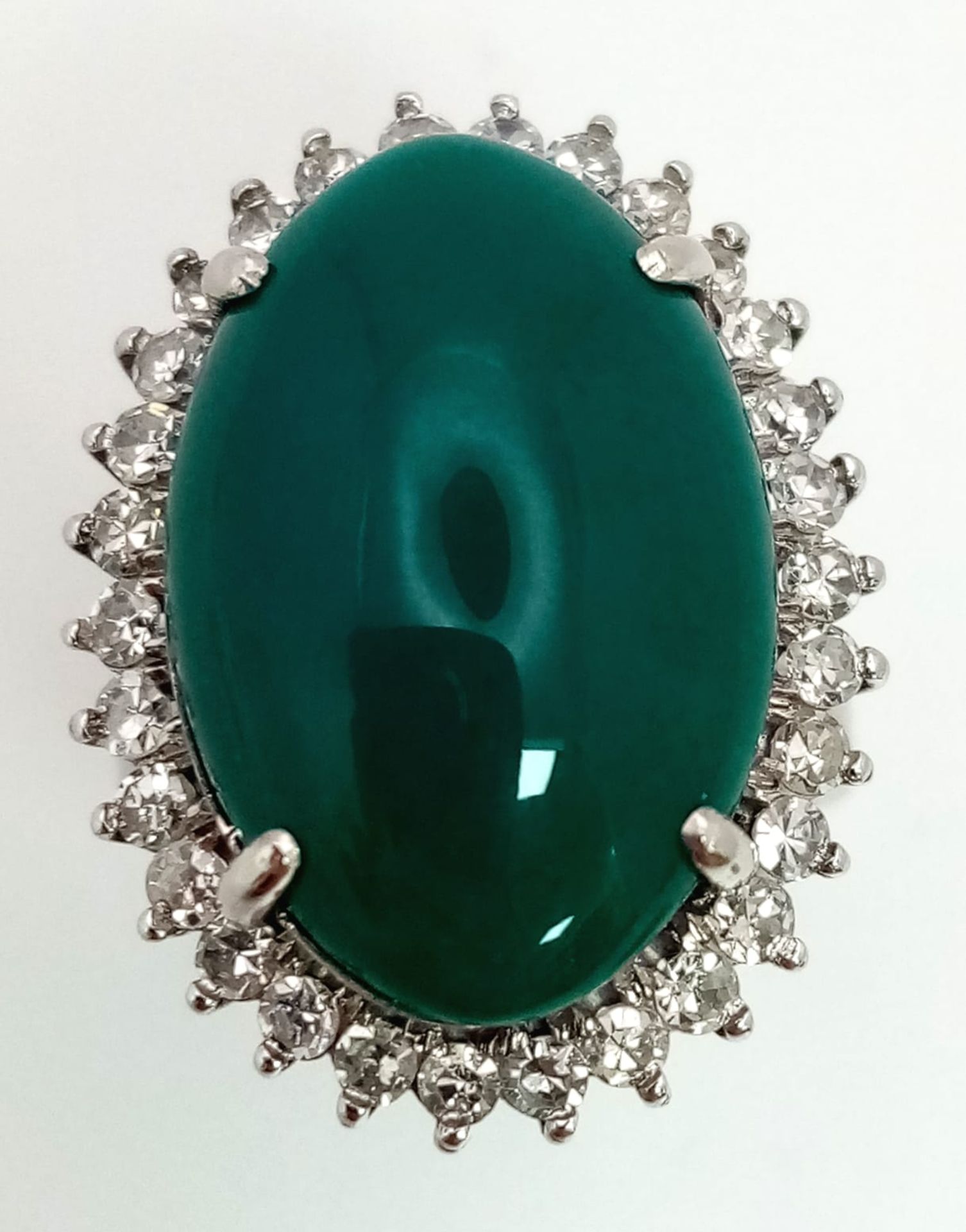 A 18K WHITE GOLD GREEN JADE CENTRE STONE SURROUNDED BY DIAMONDS RING . 0.66CT CABOCHON DIAMOND TOTAL - Image 6 of 9