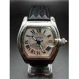A Cartier Roadster Automatic Gents Watch. Black leather strap with stainless steel case-38mm. Silver