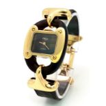 A very rare Fred of Paris 18K Gold Ladies Watch. Black leather and gilded metal bracelet. 18k gold