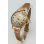 A Vintage 9k Gold JW Benson Ladies Watch. 9K Gold mesh bracelet. 9K gold case. White dial with