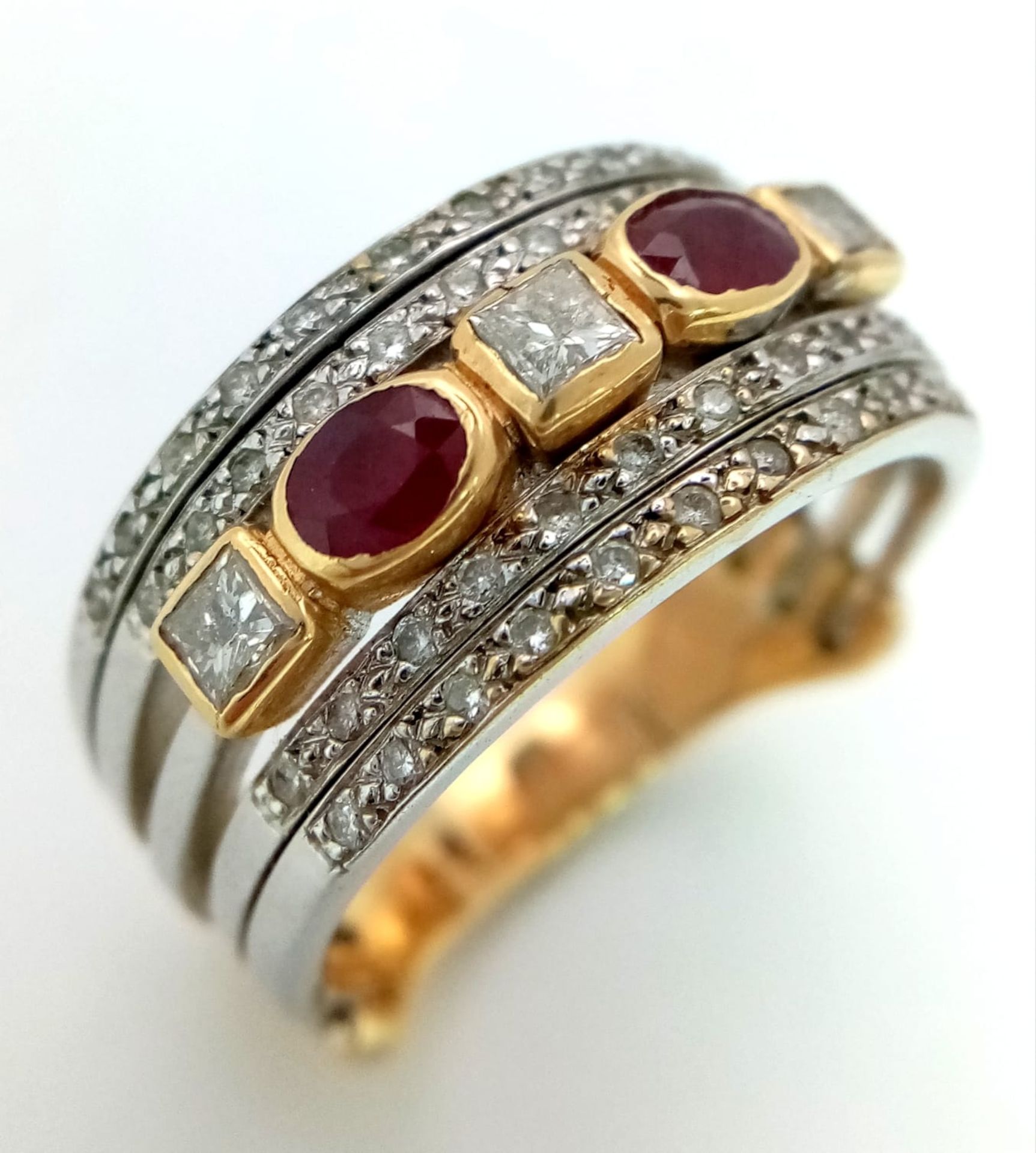 A Statement 18k Yellow, White Gold and Gemstone Band Ring. A Central reservation of oval rubies - Image 2 of 8