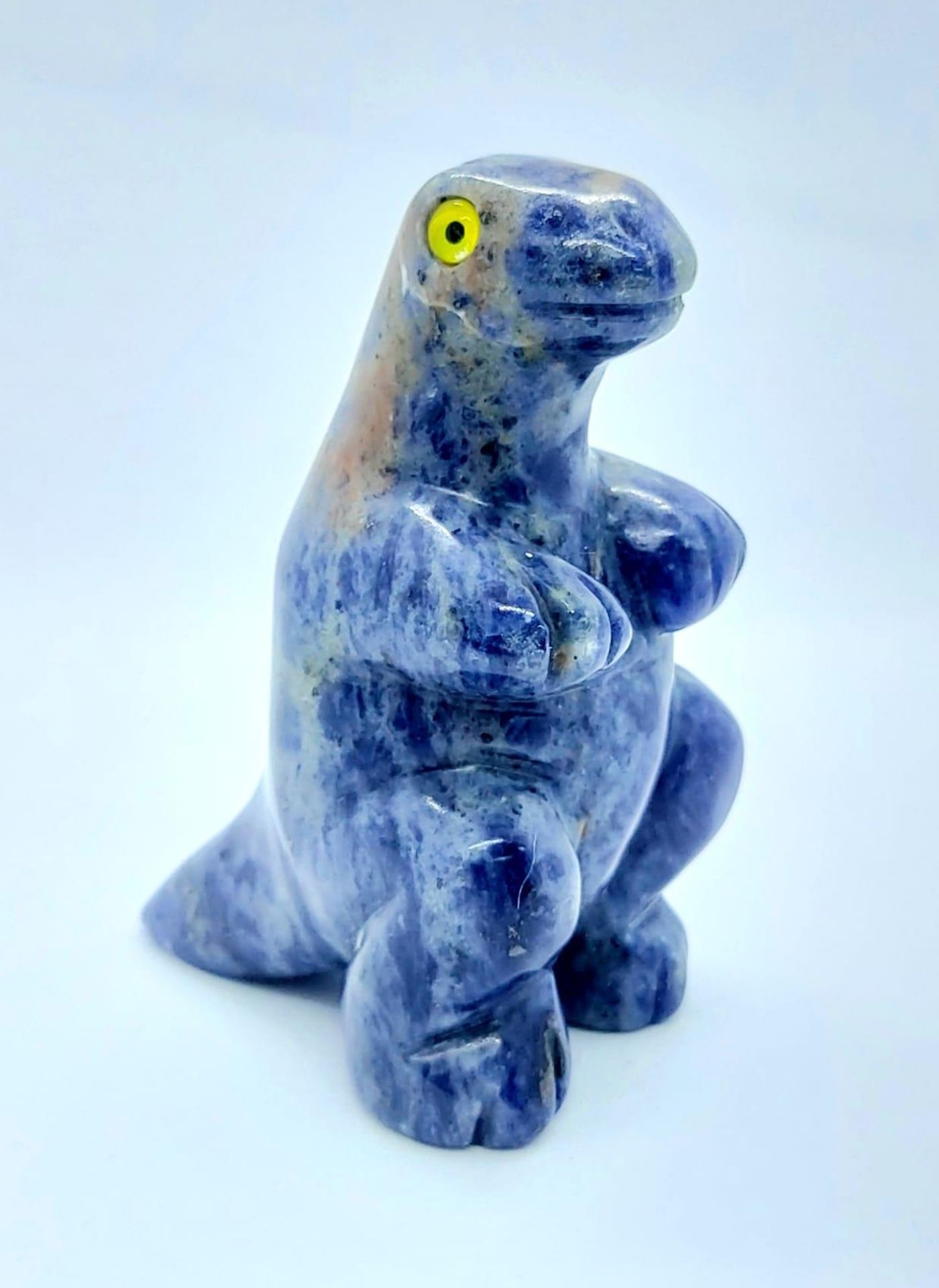 A CUTE DINOSAUR FIGURE MADE IN LAPIS WITH GEMSTONE EYES . 87gms 6cms tall