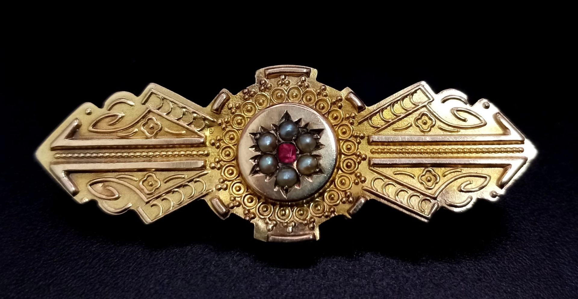 A Beautifully Decorated Antique 9K Yellow Gold Seed Pearl and Ruby Brooch. 4cm. 2.52g total weight. - Image 2 of 6