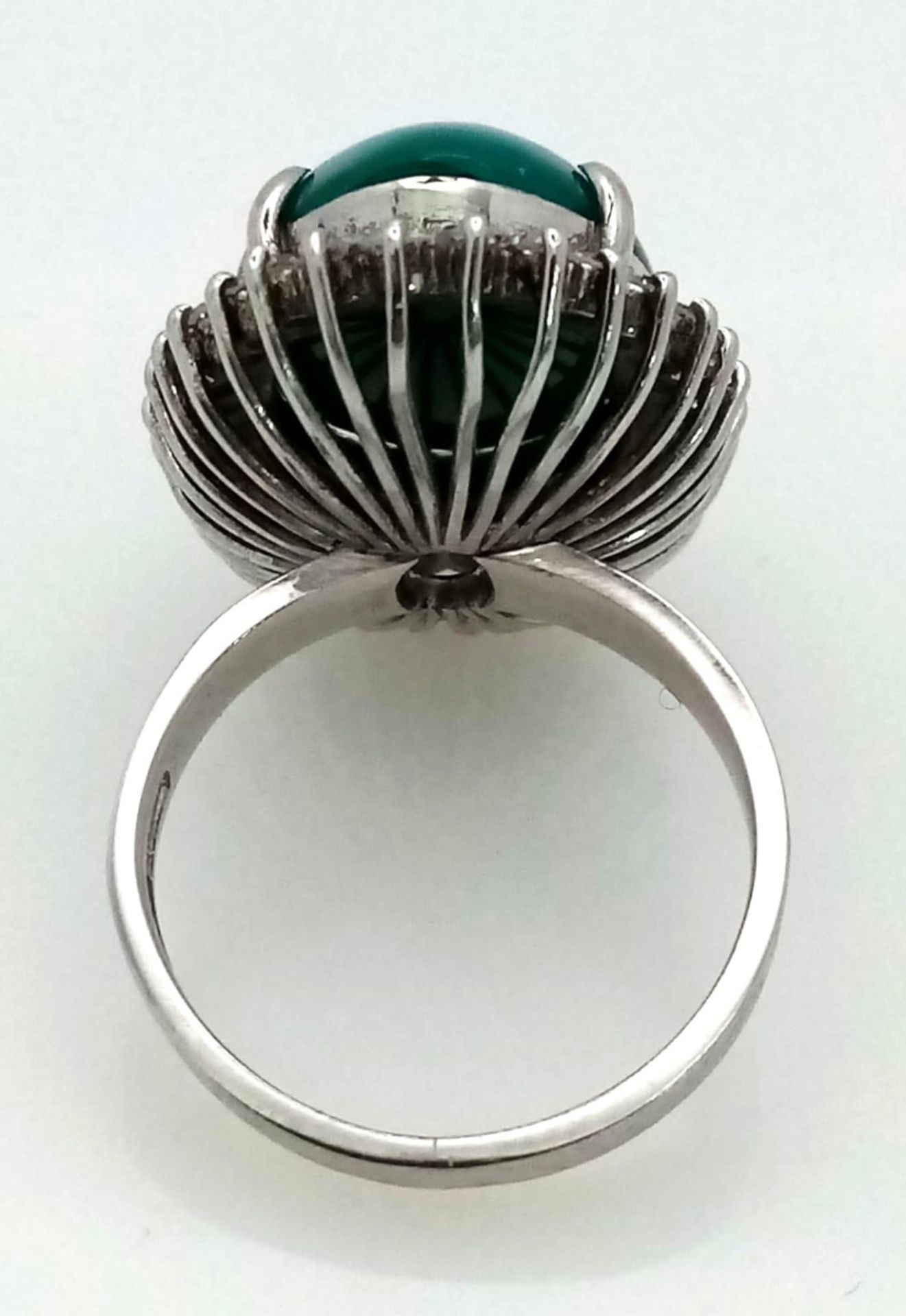 A 18K WHITE GOLD GREEN JADE CENTRE STONE SURROUNDED BY DIAMONDS RING . 0.66CT CABOCHON DIAMOND TOTAL - Image 3 of 9