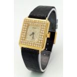 A Piaget 18K Yellow Gold and Diamond Encrusted Ladies Dress Watch. Black leather strap with Piaget