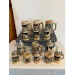 Collection of 16 colourful BEER STEINS and MUGS some having metal hinged lids,All having raised