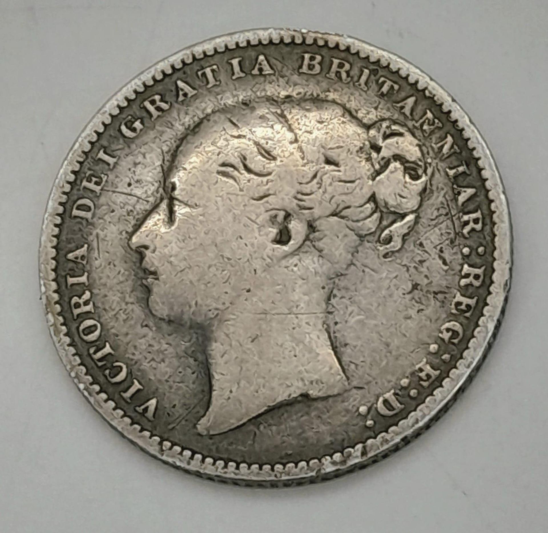 An 1879 Queen Victoria Silver Shilling. Please see photos for conditions. - Image 2 of 3