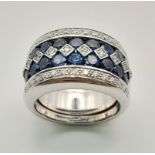 A 18K WHITE GOLD 3 ROWS OF DIAMOND & 2 ROWS OF SAPPHIRE ALTERNATING RING. TOTAL WEIGHT 20.25G.