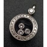 A Chopard Happy Diamond 18K White Gold Pendant. Three quality round cut floating diamonds surrounded