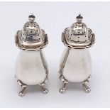 An antique pair of sterling silver pepper shakers. Full hallmarked Birmingham, 1915. Total weight