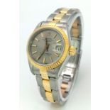 A LADIES BI-METAL ROLEX OYSTER PERPETUAL DATEJUST WITH LATEST STYLE STRAP , SILVERTONE DIAL IN AS