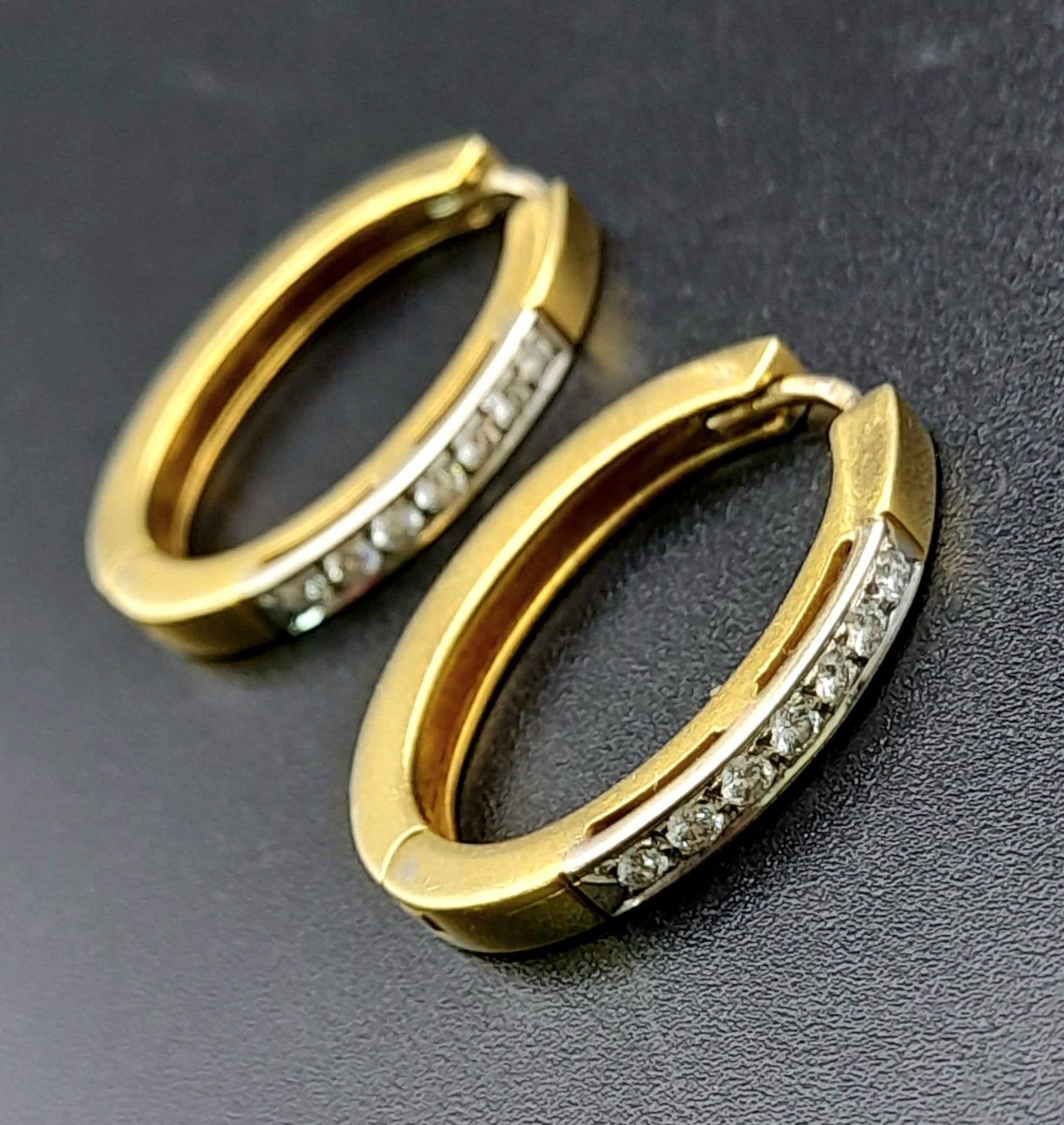 A PAIR OF 18K YELLOW GOLD 0.40CT DIAMOND SET EARRINGS. TOTAL WEIGHT 10.8G.
