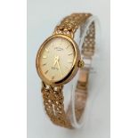 A 9 K yellow gold, ladies, ROTARY ELITE watch, oval case ( 20 x 18 mm), champagne dial, gold hour