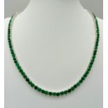 A Beautiful Emerald Tennis Necklace. Set in 925 silver. 44cm