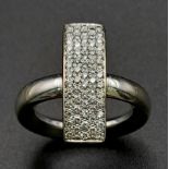 A 18K WHITE GOLD DIAMOND SET RECTANGULAR FACE RING. TOTAL WEIGHT 11.5G. SIZE K