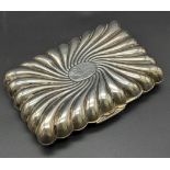 An Antique Sterling Silver Small Cigarette Case. Wave decoration emitting from central cartouche.