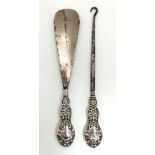 An antique matching set of sterling silver shoe horn (Full hallmarked Birmingham, 1901) and button