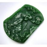 A Chinese Green Jade Tiger Pendant. 4.5cm x 3cm.