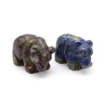 A PAIR OF HAND CARVED STONE BEARS ONE IN LAPIS AND THE OTHER IN SODOMITE . 61gms 3 X 3.5cms each