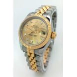 AN UPDATED STYLE LADIES ROLEX OYSTER PERPETUAL DATEJUST BI-METAL WATCH WITH DIAMOND NUMERALS . 26mm