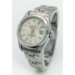 A LADIES ROLEX OYSTER PERPETUAL DATEJUST IN STAINLESS STEEL WITH SILVERTONE DIAL AND IN AS NEW