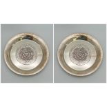 A pair of 925 silver Circular plates with embossed decoration. Total weight 100.05G. Diameter 12cm.