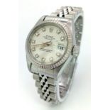 A LADIES ROLEX OYSTER PERPETUAL DATEJUST IN STAINLESS STEEL WITH DIAMOND NUMERALS AND