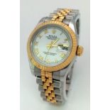 A LADIES ROLEX OYSTER PERPETUAL DATEJUST IN BI-METAL ,UPDATED STYLE WITH WHITE DIAL AND ROMAN