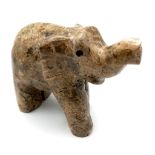 A VARNISHED NATURAL SANDSTONE ELEPHANT FIGURE . 192gms 7cms tall .