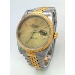 THE CLASSIC GENTS OYSTER PERPETUAL DATEJUST ROLEX WITH GOLDTONE DIAL AND BI-METAL STRAP . A WATCH WE